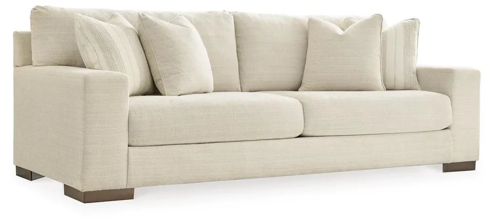 Cream upholstered sofa with scatter cushions